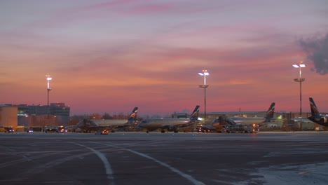 Area-of-Sheremetyevo-Airport-with-planes-and-vehicles-at-the-dawn-in-winter