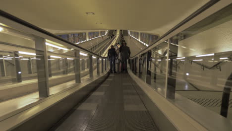 People-on-travelator-at-Charles-de-Gaulle-Airport-in-Paris-France