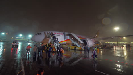 Deboarding-Hainan-Airlines-plane-and-spotters-taking-pictures