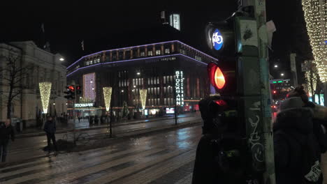 Helsinki-night-view-Finland-Street-with-Stockmann-mall-and-people-on-crosswalk