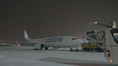 Flydubai-airplane-and-de-icing-vehicle-at-Sheremetyevo-Airport