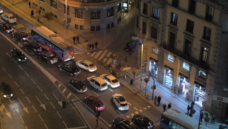 Traffic-and-buildings-in-Gran-Via-street-at-night-Madrid-Spain