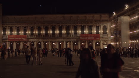 Night-view-of-Piazza-San-Marco-with-walking-people-Venice-Italy