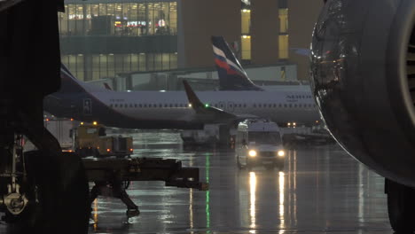 Aircraft-and-vehicles-traffic-at-Sheremetyevo-Airport-in-rainy-evening