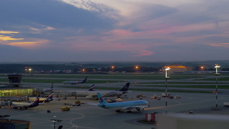 Airplanes-in-Terminal-D-of-Sheremetyevo-Airport-evening-view-Moscow-Russia