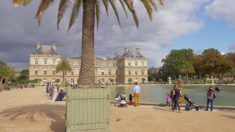 Visitors-in-Luxembourg-Gardens-View-with-Palace-and-Pool-Paris