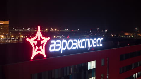 Timelapse-of-traffic-in-night-city-with-illuminated-Aeroexpress-banner-Moscow
