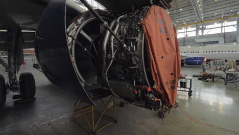 Disassembled-jet-engine-in-repair-hangar
