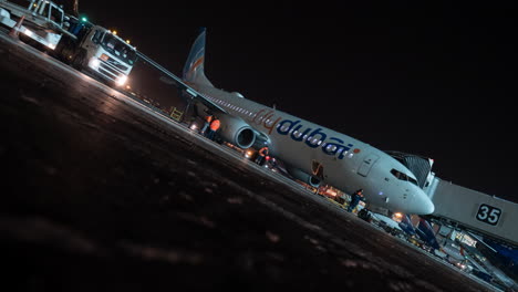 Timelapse-of-transport-traffic-and-Flydubai-plane-boarding-at-night