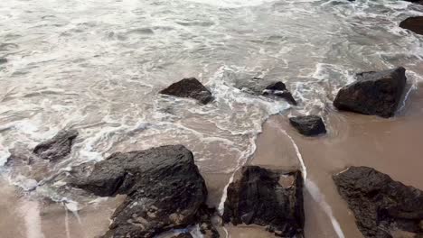 Sea-waves-crashing-into-natural-rock-formation-on-the-coastline-shores