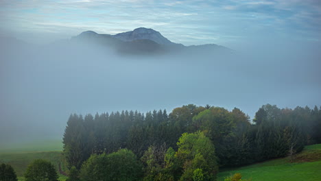 Timelapse-of-fog-and-mist-dissipating-in-valley-in-the-Alps,-Germany