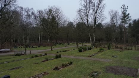 An-approach-drone-shot-of-a-German-cemetery-in-winter-season