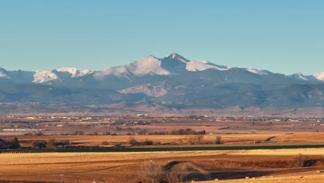 Longs-Peak-Colorado-mountain-rising-above-the-plains-drone-fly-up