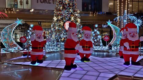 Editorial-illustrative-video-of-a-typical-rendition-of-the-dancing-Santa-theme-decor-on-display-at-the-lobby-of-SM-City-Cebu,-a-large-Philippine-mall