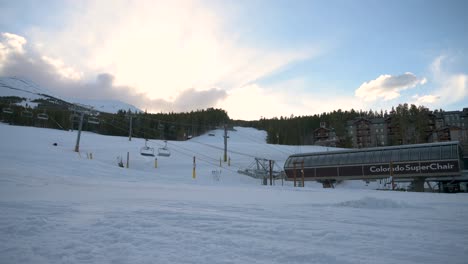 Sun-rising-on-the-Colorado-Super-Chair-lift-on-Peak-8-at-Breckenridge-Ski-Resort,-time-lapse