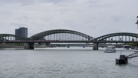Bridge-made-of-shalt-struts-and-metal-over-which-an-S-Bahn-runs-Hohenzollern-Bridge-in-Cologne-over-the-Rhine