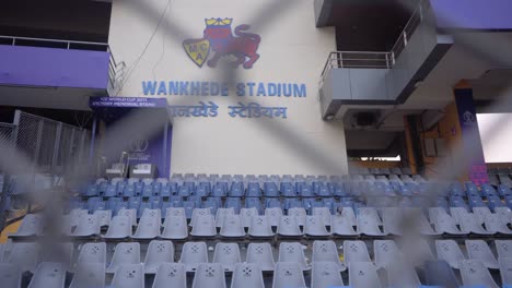 empty-chairs-in-wankhede-stadium-and-slowly-reveal-wankhede-stadium-logo-board-in-closeup-view-in-mumbai