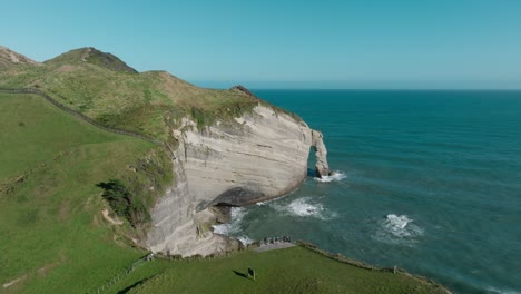 Stunning-aerial-view-of-tourist-at-scenic-lookout-point-viewing-platform-overlooking-Cape-Farewell-headland,-the-most-northerly-point-on-the-South-Island,-in-New-Zealand-Aotearoa