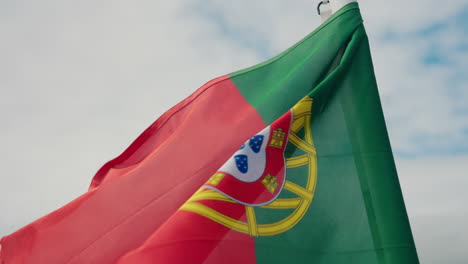 Close-up-shot-of-Portuguese-flag-waving-in-the-back-of-the-boat