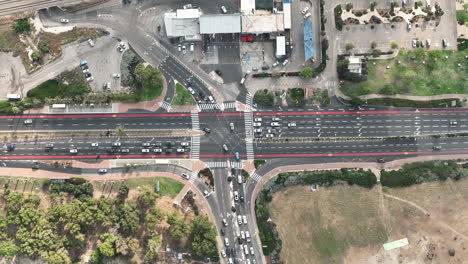Top-down-aerial-footage-of-an-intersection-in-Haifa,-Israel