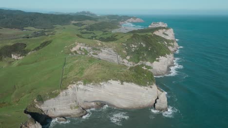 Scenic-aerial-coastal-view-of-Cape-Farewell-headland,-the-most-northerly-point-on-the-South-Island,-in-New-Zealand-Aotearoa