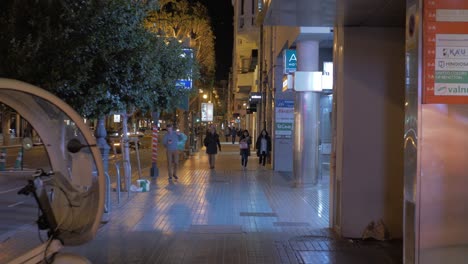 Night-walk-in-Colon-street-passing-by-the-stores-Valencia-Spain