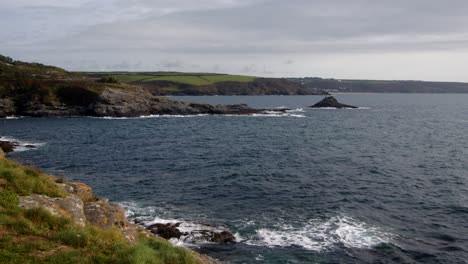 wide-shot-of-Bessy's-Cove,The-Enys-headland-with-Praa-Sands-in-the-background