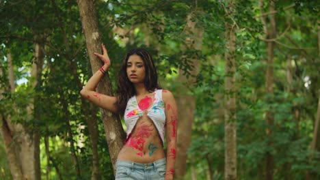 A-young-girl-adorned-with-body-paint-added-a-splash-of-color-to-the-tropical-park-scene