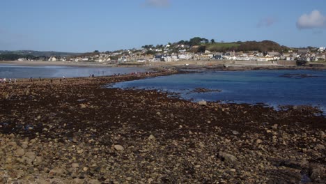 wide-shot-looking-over-Saint-Michael's-mount-Causeway-with-Marazion-in-the-background