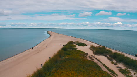 Aerial-view-of-drone-flying-towards-the-cross-in-the-beach,-headland-in-Rewa,-Poland