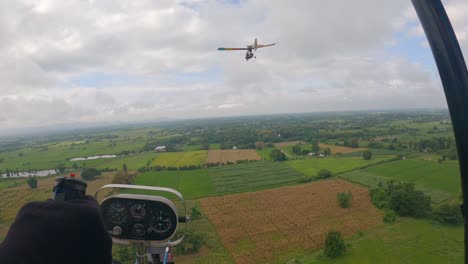 POV-of-ultralight-plane-gliding-across-down-to-the-ricefield