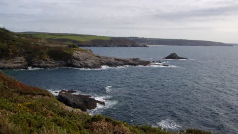 wide-shot-of-Bessy's-Cove,The-Enys-headland-with-Praa-Sands-in-the-background