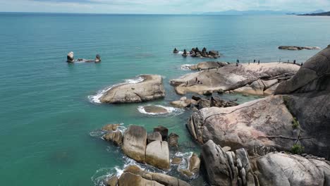 Rocky-harbor-shore-of-Koh-Samui-island-groups-in-Thailand-with-clear-turquoise-seawater