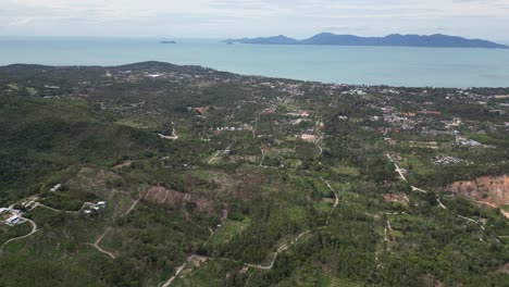 Aerial-shot-of-a-green-coastal-landscape-in-Koh-Samui-island-of-Thailand