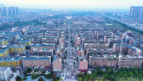 View-above-Yiwu's-residential-splendor-in-China,-captivated-by-a-magnificent-aerial-view-that-unveils-the-beauty-of-this-vibrant-living-landscape