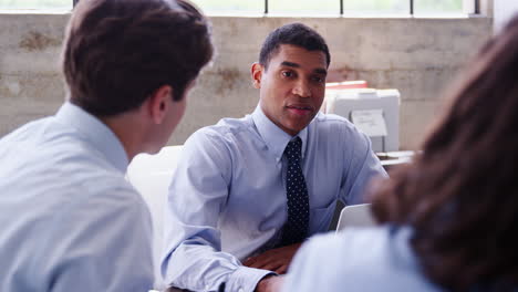 Mixed-race-businessman-meeting-with-colleagues,-close-up