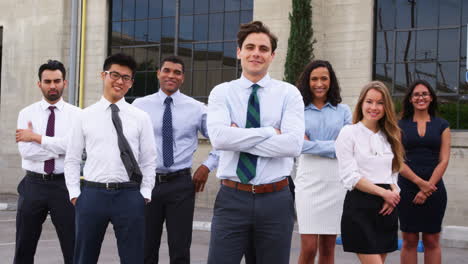 Mixed-race-group-of-young-business-colleagues-outdoors
