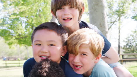 Portrait-Of-Group-Of-Young-Boys-With-Friends-Having-Fun-In-Park-Shot-In-Slow-Motion