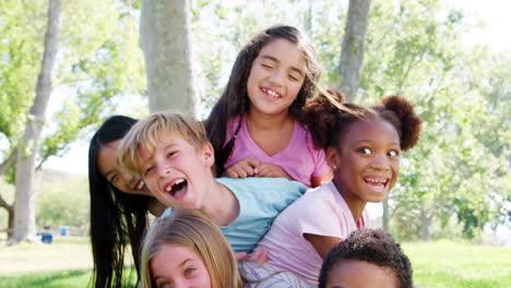 Portrait-Of-Group-Of-Children-With-Friends-Having-Fun-In-Park-Shot-In-Slow-Motion