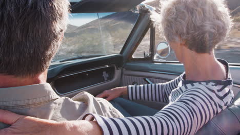 Senior-couple-in-open-car,-woman-in-passenger-seat,-close-up