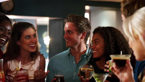 Group-Of-Young-Friends-Meeting-For-Drinks-In-Cocktail-Bar