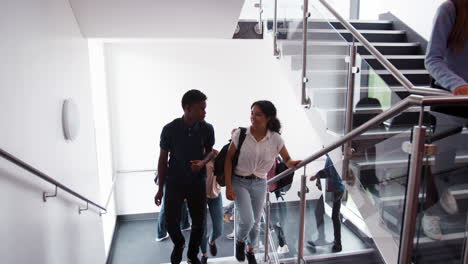 High-School-Students-And-Staff-Walking-On-Stairs-Between-Lessons-In-Busy-College-Building