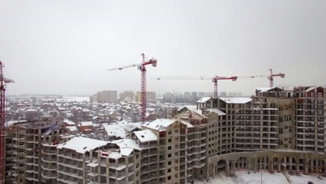 Flying-over-construction-site-of-residential-compound-in-winter-city-Russia