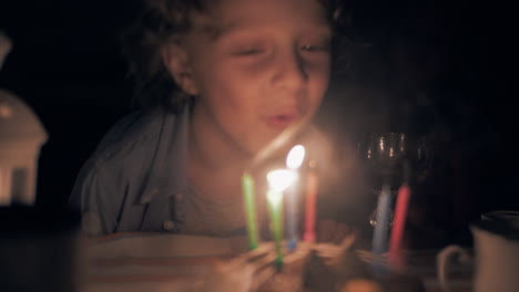 Boy-blowing-out-his-birthday-candles