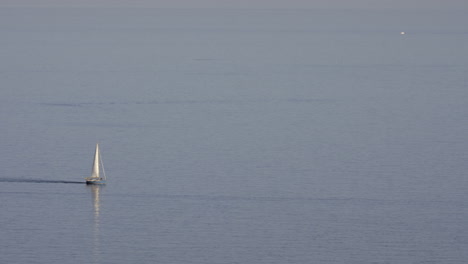 A-small-blue-yacht-on-the-sea-surface