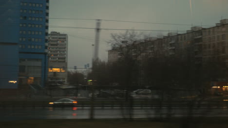 Autumn-evening-city-in-the-window-of-moving-train-Moscow-Russia