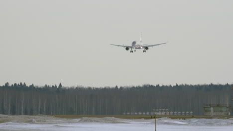 An-airplane-landing-above-the-forest