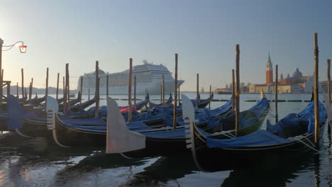 Gondola-boats-and-a-cruise-ship-in-Venice-Italy