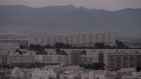Alicante-buildings-against-misty-evening-mountains