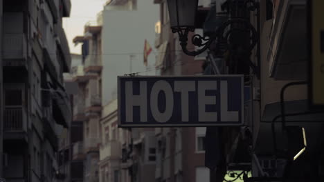 Street-with-apartment-houses-and-hotel-banner-in-Alicante-Spain